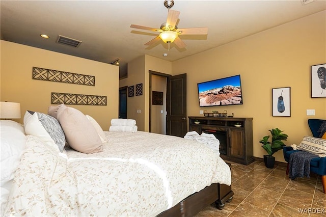 bedroom with ceiling fan and visible vents