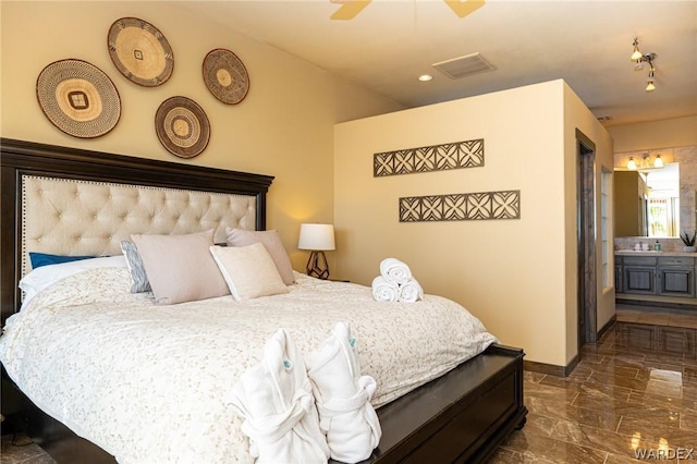 bedroom featuring marble finish floor, visible vents, connected bathroom, and baseboards