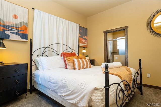 bedroom with baseboards and dark colored carpet