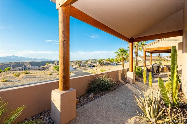 view of patio / terrace with a mountain view