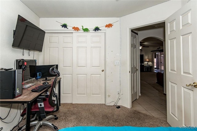 2355 Morningside Dr, Bullhead City, AZ 86442 - carpeted office space with tile patterned floors, arched walkways, and a ceiling fan