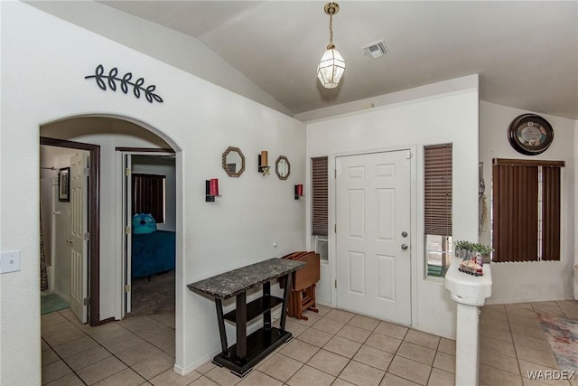 2355 Morningside Dr, Bullhead City, AZ 86442 - entrance foyer featuring light tile patterned flooring, arched walkways, and lofted ceiling