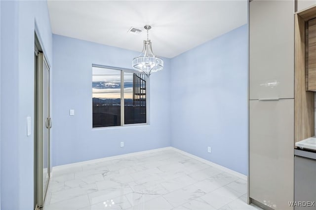 unfurnished dining area featuring marble finish floor, visible vents, baseboards, and an inviting chandelier