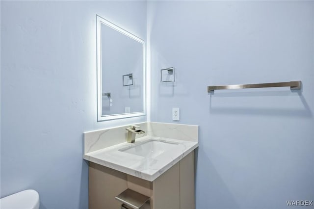 half bath with toilet and vanity