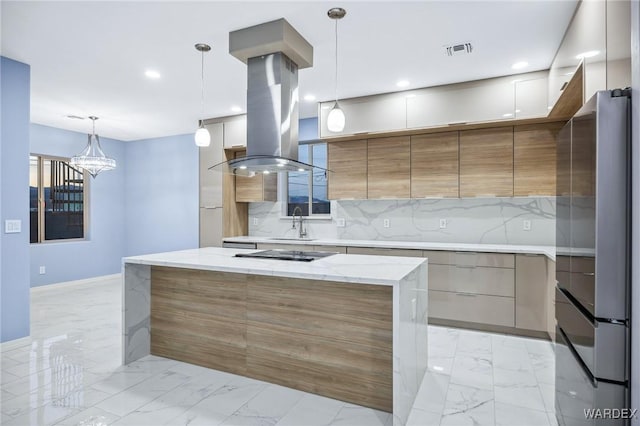 kitchen with marble finish floor, modern cabinets, pendant lighting, and freestanding refrigerator