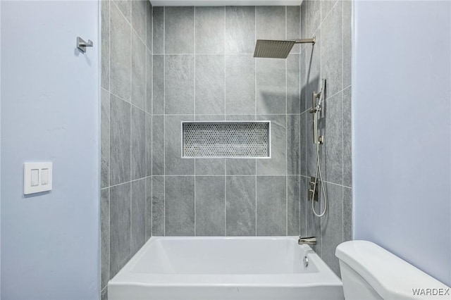 full bathroom with bathing tub / shower combination and toilet