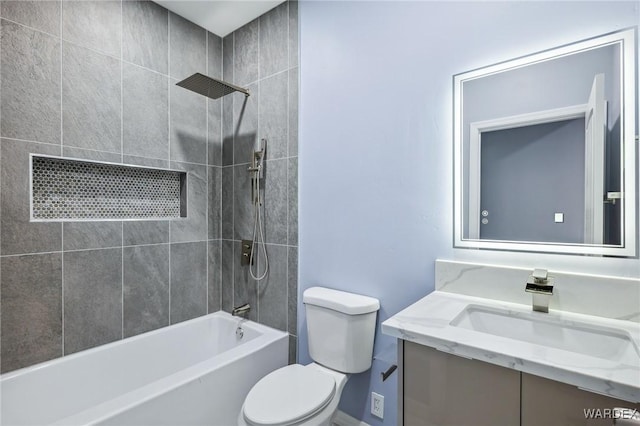 bathroom featuring toilet, bathing tub / shower combination, and vanity