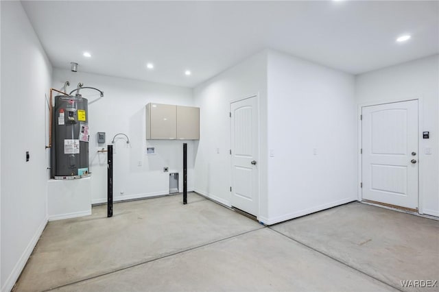 laundry room featuring cabinet space, baseboards, electric water heater, washer hookup, and recessed lighting