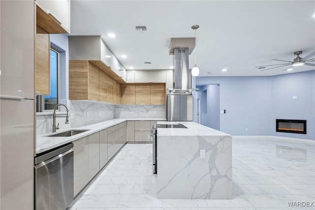 kitchen featuring modern cabinets, decorative light fixtures, light stone countertops, marble finish floor, and stainless steel appliances