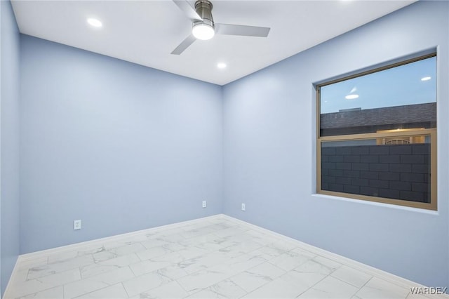 unfurnished room with marble finish floor, baseboards, a ceiling fan, and recessed lighting