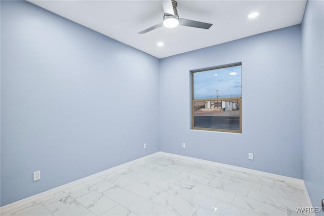 spare room with marble finish floor, recessed lighting, a ceiling fan, and baseboards