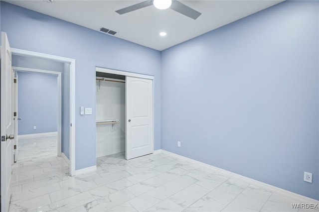 unfurnished bedroom with marble finish floor, recessed lighting, a closet, visible vents, and baseboards