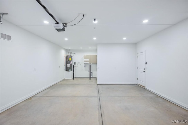 garage featuring electric water heater, recessed lighting, visible vents, baseboards, and a garage door opener