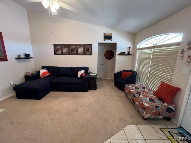 living room with baseboards, ceiling fan, vaulted ceiling, and carpet flooring