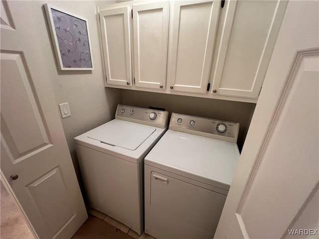 laundry area featuring cabinet space and washer and clothes dryer