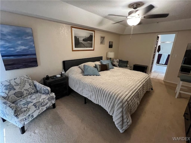 bedroom featuring light carpet and a ceiling fan