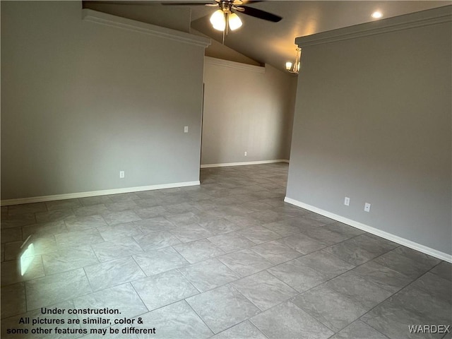 spare room with a ceiling fan, lofted ceiling, and baseboards