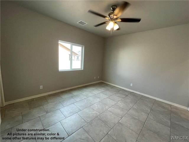 unfurnished room with baseboards, visible vents, and a ceiling fan