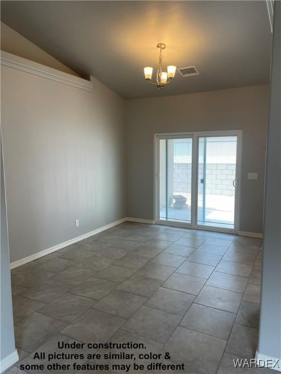 spare room featuring a chandelier, vaulted ceiling, visible vents, and baseboards