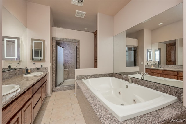 bathroom featuring double vanity, a sink, visible vents, and a shower stall