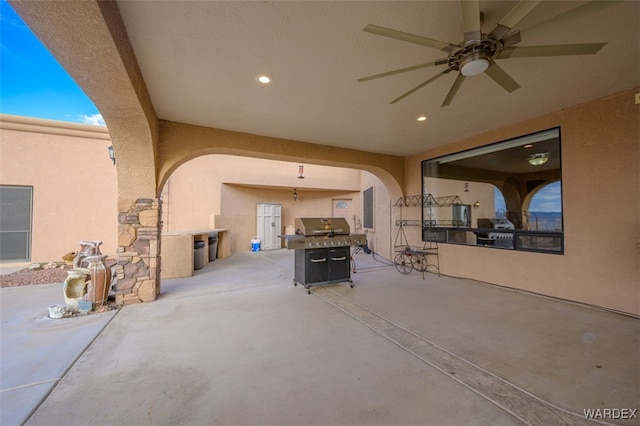 view of patio featuring ceiling fan