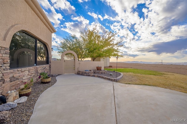 view of patio / terrace featuring a gate