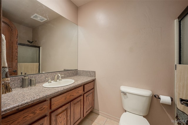 full bath featuring a shower with door, visible vents, toilet, vanity, and tile patterned floors