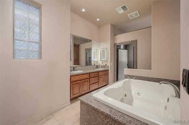 full bath featuring double vanity, tile patterned flooring, a sink, and visible vents