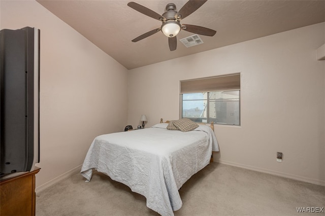 bedroom featuring baseboards, ceiling fan, visible vents, and light colored carpet