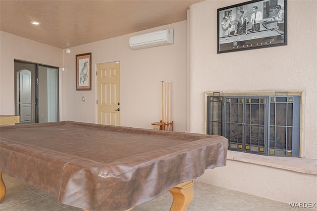 rec room featuring pool table, a wall unit AC, and light tile patterned floors