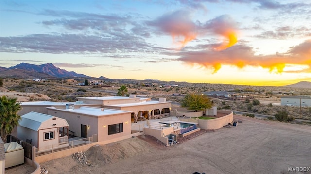 drone / aerial view featuring a mountain view