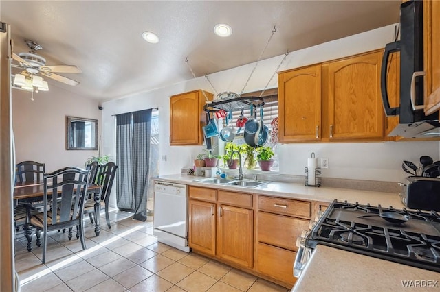 kitchen with stainless steel gas stove, black microwave, light countertops, and dishwasher