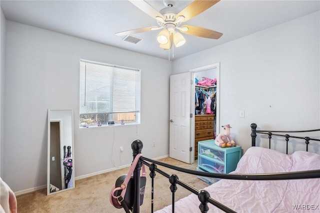 bedroom with light carpet, ceiling fan, visible vents, and baseboards