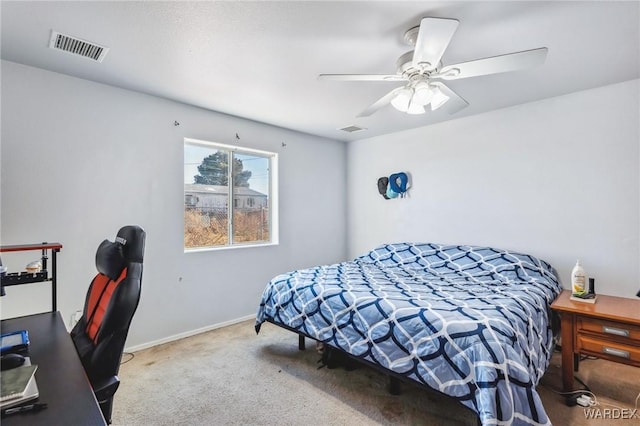 carpeted bedroom featuring baseboards, visible vents, and a ceiling fan