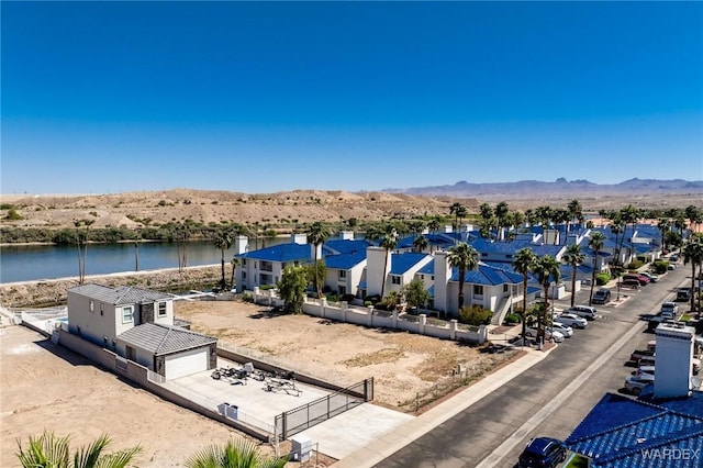 aerial view featuring a residential view and a water and mountain view