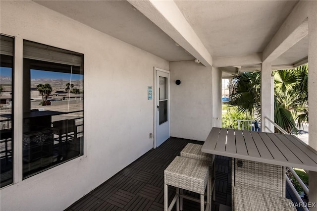 view of patio featuring a balcony