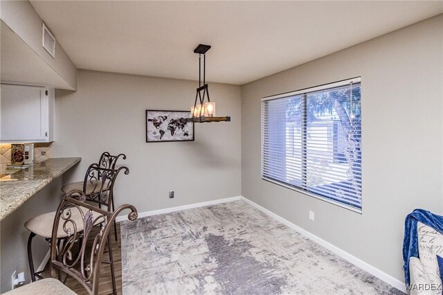 dining area with visible vents and baseboards