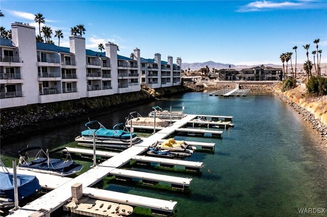 dock area featuring a water and mountain view