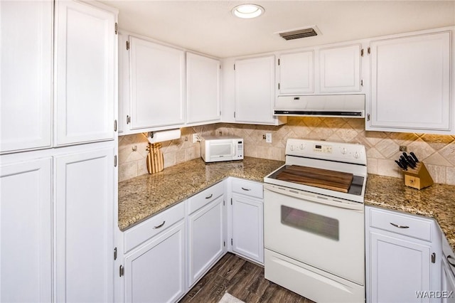 kitchen featuring visible vents, white appliances, white cabinetry, and under cabinet range hood