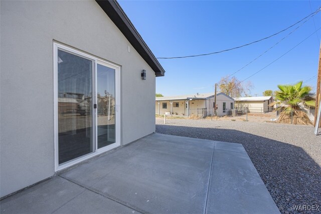 view of patio featuring fence