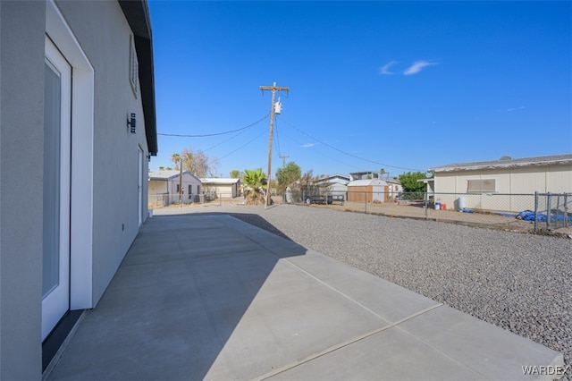 view of patio with a fenced backyard and a residential view