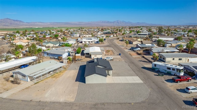 drone / aerial view featuring a residential view and a mountain view