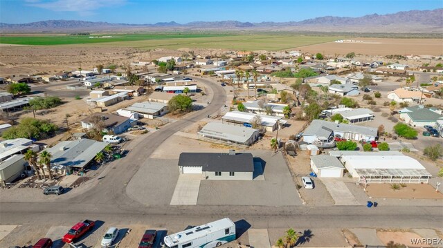 drone / aerial view featuring a residential view and a mountain view