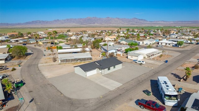 drone / aerial view with a residential view and a mountain view