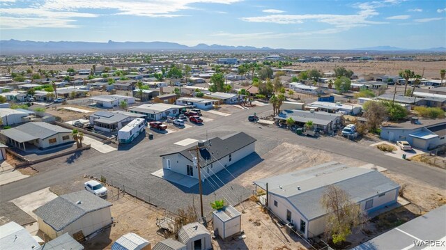 drone / aerial view featuring a residential view and a mountain view