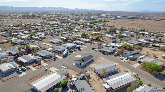 drone / aerial view featuring a residential view and a mountain view