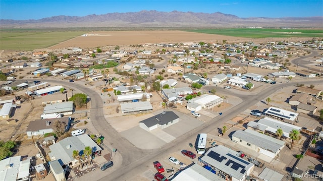 birds eye view of property with a residential view and a mountain view