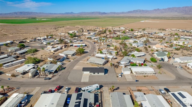 birds eye view of property with a mountain view