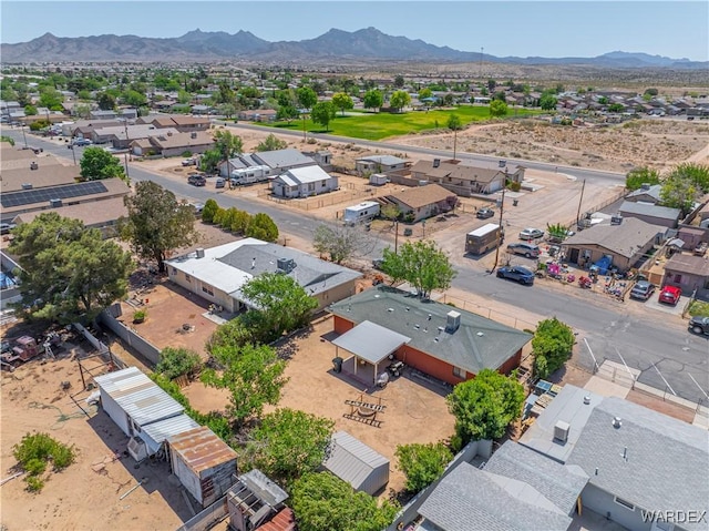 drone / aerial view featuring a residential view and a mountain view