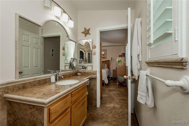 ensuite bathroom featuring ensuite bath and vanity